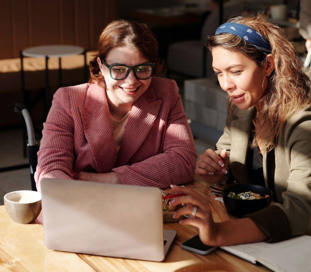 two women in an online meeting about CSR-sponsored education programs