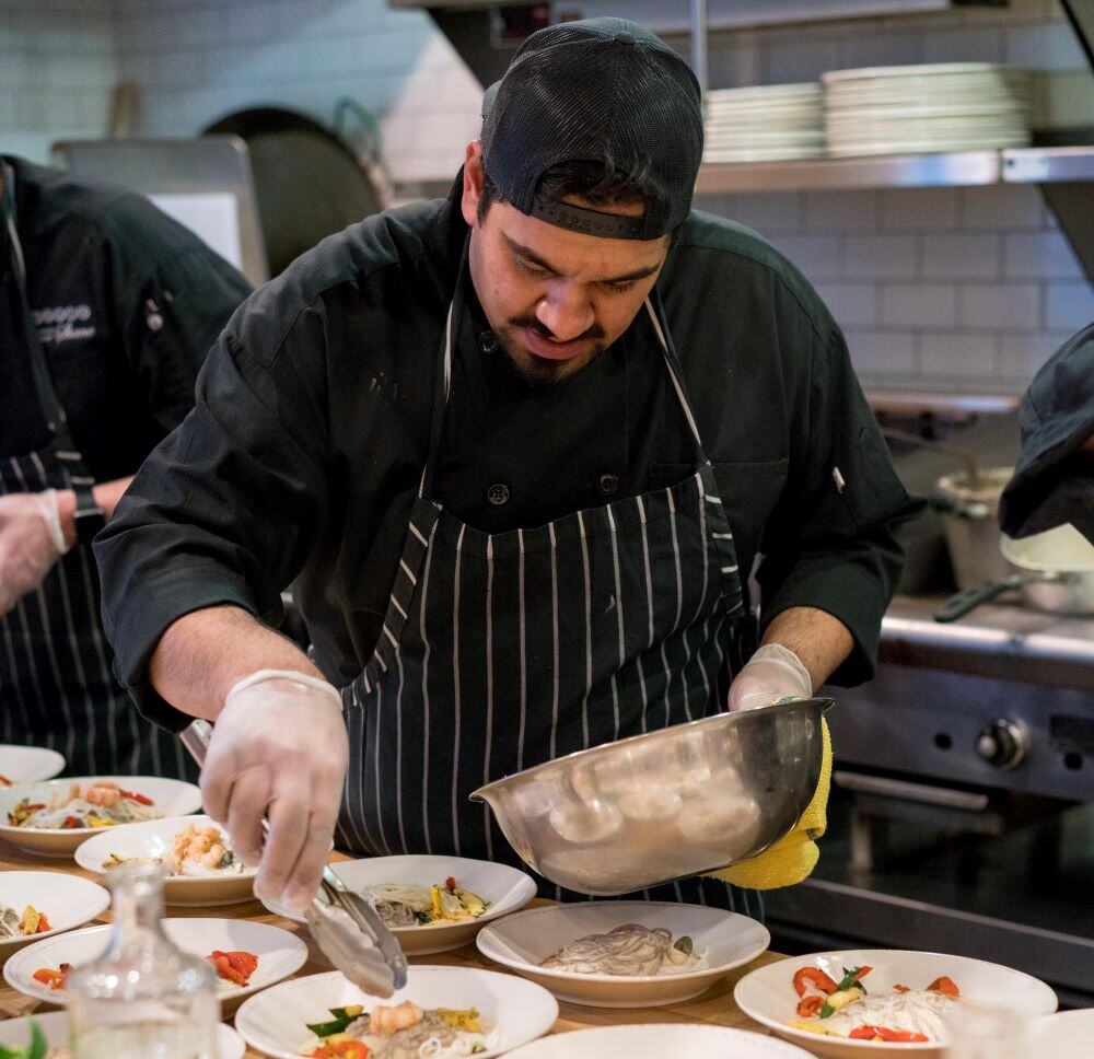 compliance training - restaurant cook putting food on plates