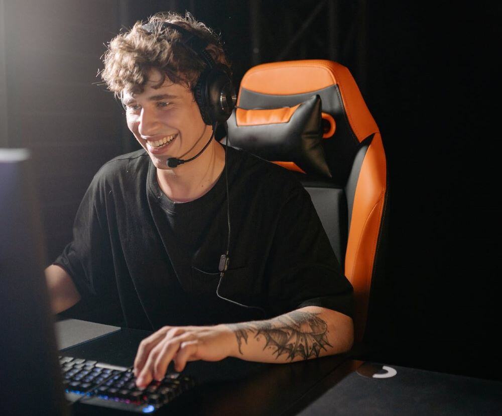 young member smiling during an online career workshop in the midst of an employers’ job market