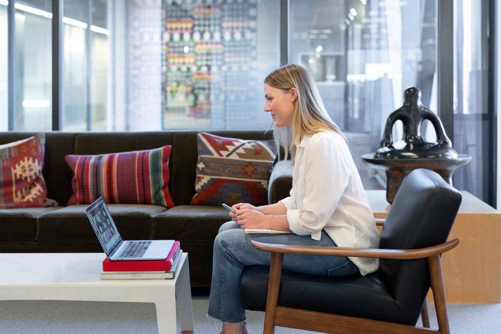 woman with a laptop enjoying an engaging online learning experience 