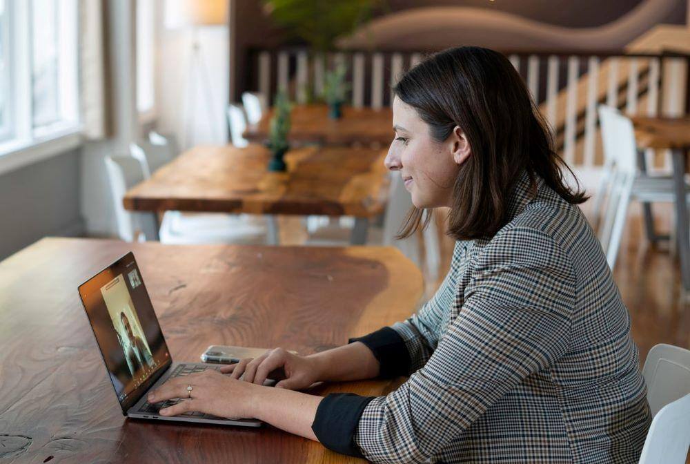 career changers, like this woman getting advice from someone via her laptop