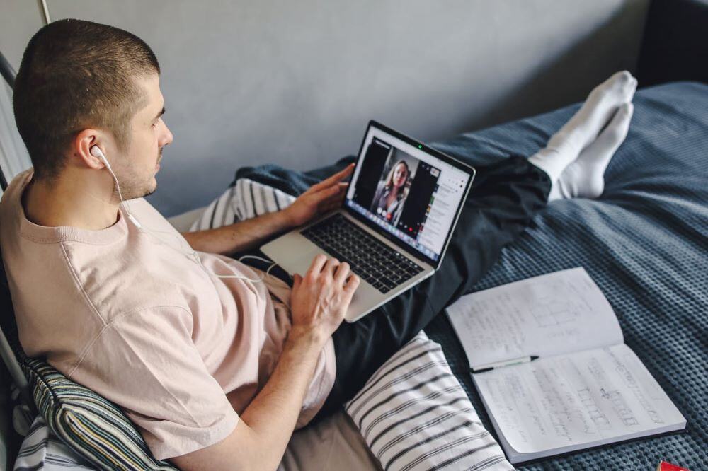 young man facilitating a webinar chat - example of recruiting volunteers and SMEs for online education programs