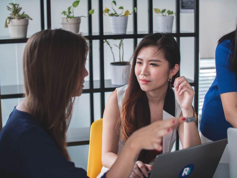 A woman listening intently to another woman