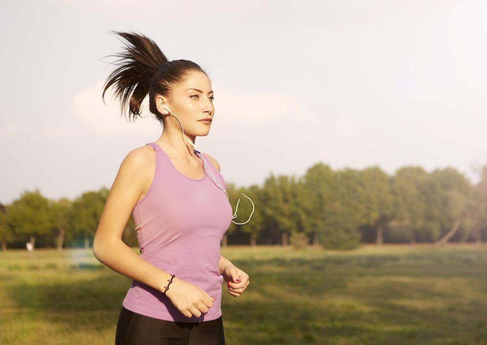 launching a podcast for this lady out on a run wearing earbuds