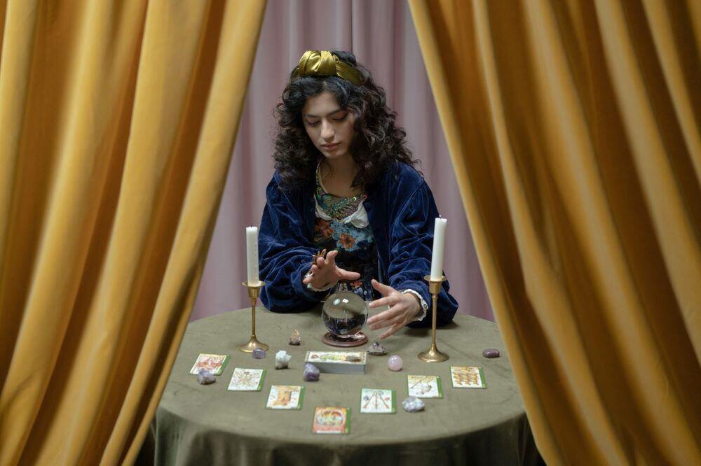 tarot card reader is predicting a return to virtual